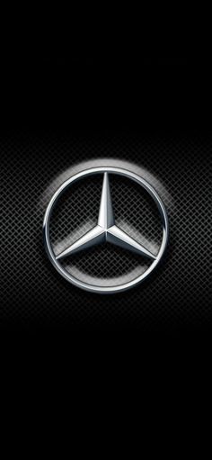 the mercedes logo on a black background