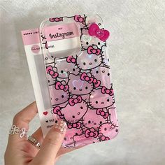 a hello kitty phone case is shown with a pen