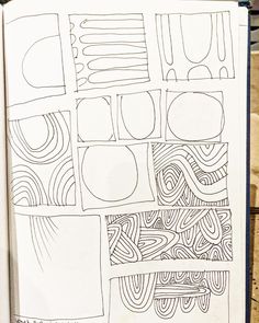 an open book with doodles and lines drawn on the pages, including one line