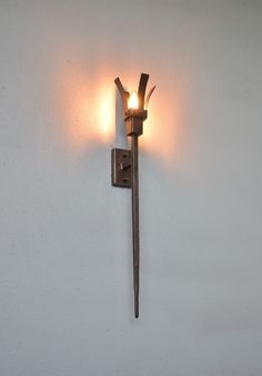 Please read the description carefully and completely, and if you have additional questions, feel free to contact me via messages. This wall mounted torch lamp is a modern interpretation of wall lamps used in medieval castles. With its square shape it will fit even into modern interiors and will be a real eyecatcher.   A traditional wall light in a wrought iron reminiscent of candelabras used in medieval castles. In gothic styling,this torch lamp look great in hallways,bedrooms and living rooms i Medieval Torch, Torch Lamp, Medieval Castles, Chateau Medieval, Viking Style, Torch Light, Bedside Lighting, Copper Patina, Medieval Fashion