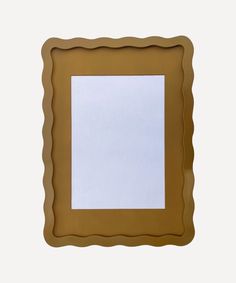 a brown frame with a white paper in the middle