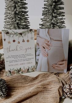 two christmas trees are placed next to a card with the words thank you on it