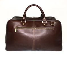 The leather travel bag is perfect for business or weekend trips. Suitable for men and women. Handmade, original design. Very light weight. Dimensions: * Height: 29 cm (11.42 inches) * Length: 50 cm (19.69 inches) * Width: 20 cm (7.87 inches) * Strap Drop length: max 130 cm (51.18 inches) Details: * One main part * Removable adjustable shoulder strap * Double leather handle * Two outside zipper pockets in the front of the bag * Zipper pocket inside * Two slip pockets inside Leather travel bag wit Brown Leather-lined Weekender Bag For Business Trips, Brown Business Weekender Bag With Luggage Sleeve, Brown Satchel Duffle Bag For Business, Brown Weekender Bag For Business Trips, Brown Large Capacity Weekender Bag For Business, Brown Rectangular Business Weekender Bag, Formal Brown Travel Bag With Luggage Sleeve, Brown Large Capacity Travel Bag For Business, Modern Brown Travel Bag For Business