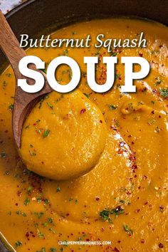 butternut squash soup in a pot with a wooden spoon and text overlay that reads butternut squash soup