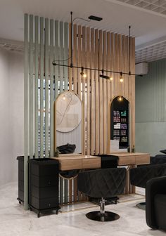 a salon with black chairs and mirrors on the wall, along with wooden slats