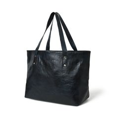 Introducing the everyday shopper shoulder tote, a lightweight marvel that transcends style and functionality. With one central compartment accommodating files, diaries, documents, and laptops, it blends practicality with sophistication. Contrasting metal buttons on the handles and bottom offer structural support, defining its chic design. This tote black with a touch of blue shade bag isn't just a fashion statement; it's crafted from eco-friendly buffalo leather, naturally tanned without chemica Black Tote, Buffalo Leather, Shoulder Tote, Metal Buttons, Black Tote Bag, Chic Design, Large Bags, Stylish Accessories, Fashion Statement