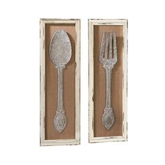 two silver spoons and a fork in a shadow box