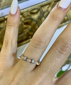 Metal: 14K White And Rose Gold Stone: Diamond Stone Shape: Round Diamonds Weight: .18 ctw Weight: 2.40 grams Width Of Center Part Of Band: 4.00 mm Height Of Band: 22.00 mm Width Of Shoulders: 2.00 mm Ring Size: 7 Sizable: Yes Gold Diamond Stackable Rings With Multi-stone, Gold Stackable Multi-stone Diamond Rings, Elegant Gold Multi-stone Diamond Ring, Elegant Diamond Multi-stone Stackable Rings, Gold Multi-stone Diamond Ring For Anniversary, Elegant Multi-stone Stackable Rings, Elegant Multi-stone Stackable Rings For Anniversary, Elegant Rose Gold Stackable Rings Hallmarked, Elegant White Gold Stackable Rings With Multi-stone