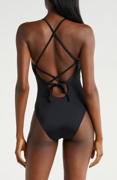 This timeless one-piece features a classic silhouette and an adjustable lace-up back for the perfect fit. Lined   Adjustable back tie closure   Cheeky back coverage   80% recycled nylon, 20% spandex   Hand wash, dry flat   Imported Elegant Solid Color Low Back Swimwear, Nylon Swimwear With Tie And Strappy Back, Fitted Low Back Swimwear With Back Opening, Summer Swimwear With Lace-up And Strappy Back, Chic Solid Color Swimwear With Tie Back, Strappy Lace-up Back Swimwear For Summer, Strappy Back Lace-up Swimwear For Summer, Fitted One-piece Swimwear With Back Opening, Elegant Poolside Swimwear With Back Closure