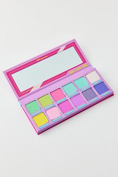 A 12-pan eyeshadow palette from Trixie Cosmetics inspired by the nostalgic colors of childhood. This eyeshadow palette features a blend of shimmering and matte shades and is complete with a sticker sheet so you can customize your new favorite palette. Features Trixie Cosmetics Girl Talk 12-Pan Eyeshadow Palette 12 Shades in shimmering & matte finishes Sticker sheet to decorate your new go-to eyeshadow palette Vegan & cruelty free Shades Cooties: Catching light green with gold and blue reflects S Glamlite Palette, Trixie Cosmetics, Speed Dial, Pink Metallic, Gold And Blue, Blue Raspberry, Sugar Rush, Girl Talk, Wellness Gifts