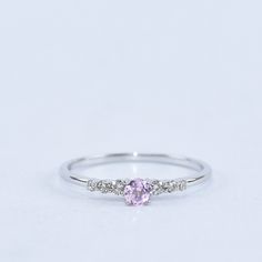 Pink Sapphire Engagement Ring, Birthstone Ring, Dainty Ring, Sapphire Engagement Ring, Promise Ring, Wedding Ring, Gift for her  DIRI Jewels 1. Product Details ✧ Material : High Quality Solid 925 Sterling Silver  ✧ Color Options:  14K Gold, 14K White Gold ✧ Stone Type: Simulated Pink Sapphire  2. Shipping & Packaging Details ☐ Dispatches in 4 - 8 business days ☑ Multiple shipping speeds available 3. Custom Orders Its simple, just get in touch with us and we'll take care of the rest. 4. Returns * Cute Simple Rings Silver, Silver Ring With Pink Stone, Pink Sapphire Silver Ring, Simple Ring Silver, Simple Silver Promise Rings, Pink Engagement Ring Silver, Dainty Promise Rings Silver, Promise Rings For Her Silver, Pink Promise Rings