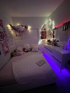 a bedroom decorated in pink and white with hello kitty decorations