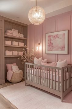 a baby's room with pink walls and white carpeted flooring is shown