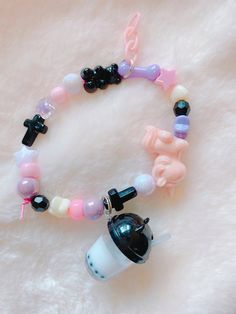 You'll get 1 bracelet. Handmade by me. :) the bracelet its made with a stretchable cord. Very sturdy and cute. Pastel Goth Bracelets, Adjustable Pink Kawaii Charm Bracelet, Cute Purple Charm Bracelet For Friendship, Pink Adjustable Kawaii Beaded Bracelets, Kawaii Adjustable Pink Beaded Bracelet, Handmade Adjustable Pastel Goth Jewelry, Adjustable Pink Beaded Bracelets In Kawaii Style, Adjustable Pink Beaded Bracelet In Kawaii Style, Handmade Pink Kawaii Charm Bracelet