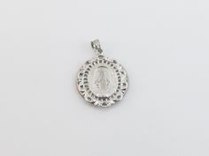 "fabulous 14k solid White Gold Virgin Mary Charm Pendant! * Material: 14k gold, Not plated or filled * Pendant Length: 1\" or 27 mm long not including the bail * Pendant Width: 7/8\" or 22 mm wide * Weight: 3.80 grams * Complementary Gift Box There is a prayer around Mary which says: O Mary conceived without sin pray for us who have recourse to thee. This Pendant is the same size as a quarter. Images may be enlarged to show detail and the item may look larger than it appears in person.In order t Miraculous Medal Pendant Jewelry For Wedding, Miraculous Medal Wedding Pendant Jewelry, Wedding Miraculous Medal Pendant Jewelry, White Gold Miraculous Medal Round Pendant, Miraculous Medal Pendant For Wedding, Wedding Miraculous Medal Pendant, Commemorative White Gold Jewelry With Charms, Elegant Commemoration Jewelry With Charms, Anniversary Miraculous Medal Round Pendant Jewelry