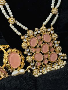 Style your traditional classic/modern wearables with this beautiful blush pink stone engraved pear Maala Necklace Set . This piece includes a faux pearls necklace chain with matching stud style Earrings pair. Embrace that traditional yet stylish classic look in your modern lifestyle now.  Traditional Artificial Indian/Pakistani Jewelry which can be perfectly styled for formal and classic traditional look. We have got covered your taste within budget. We make sure to sell wearable artworks that you can keep forever. We provide very safe and nice packaging service including cute boxes with cotton/foam liners. Don't Miss On This Unique Piece And Bling It Out.  Disclaimer: All our products are 100% Handmade jewelry, so please expect some slight variations in colors, shades and texture from the Pearl Chain Jewelry Sets For Celebration, Elegant Pink Bridal Necklace For Festive Occasions, Elegant Pink Bridal Necklace For Festive Seasons, Formal Pearl Jewelry With Stone Work, Elegant Pink Necklace For Festive Occasions, Traditional Pink Kundan Necklace For Formal Occasions, Elegant Pearl Necklaces With Stone Work, Pink Stone Work Necklace For Party, Festive Jewelry Sets With Pearl Chain