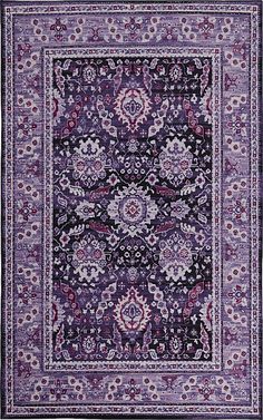 a purple and black rug with an ornate design on the center, surrounded by flowers