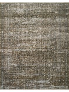 an area rug with different colors and patterns on the carpet, including brown, gray, beige