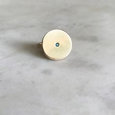 A simple circle ring with a genuine turquoise stone. Each piece varies slightly due to its handmade nature.Hand made in our south Louisiana studio. Contact us for 14k gold pricing. Minimalistic Rings, Silver Market, Pop Jewelry, Customizable Jewelry, Bronze Jewelry, Circle Ring, Stone Collection, Single Stone, Birthstone Bracelets