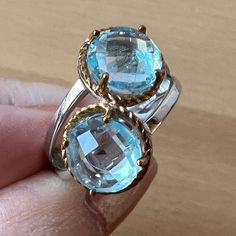 This Gorgeous Double Blue Topaz Stone Ring Features Two 8mm Round Sky Blue Topaz Briolettes, Sterling Silver With 14 Karat Gold Rim Around The Stones.Size7 , Such A Beautiful, Refreshing Ring !!! Luxury Blue Topaz Ring With Polished Finish, Luxury Polished Blue Topaz Ring, Elegant Topaz Ring, Fine Jewelry With Blue Topaz And Vs Clarity, Fine Jewelry With Vs Clarity Blue Topaz, Elegant Yellow Gold Topaz Ring In Sterling Silver, Luxury Sterling Silver Birthstone Gemstones, Luxury Faceted Gemstones For Anniversary, Elegant Light Blue Faceted Jewelry