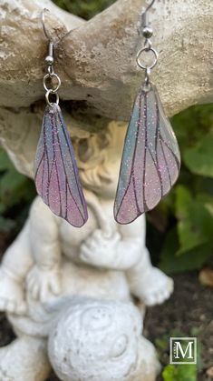 Pretty holographic glitter butterfly wing earrings in pink and blue.  Lightweight for everyday wear. 3 colors available. Iridescent Fairy Style Jewelry For Party, Iridescent Fairy Jewelry For Parties, Whimsical Iridescent Earrings With Ear Wire, Handmade Fairy Earrings For Party, Handmade Wing-shaped Jewelry For Party, Iridescent Fairy-style Jewelry For Parties, Diy Fairy Wing Earrings, Fairycore Pink Earrings As Gift, Fairycore Pink Earrings For Gifts