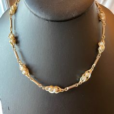 "Sarah Coventry \"Twirling Pearl\" necklace.  This 1969's gold tone necklace is marked Sarah Cov.  The faux pearls are caged by gold tone twirls.  The twirls are separated by long gold tone links.   Great condition!  All jewelry comes in a gift box. Shop more vintage necklaces go to https://www.Etsy.com/shop/Historicallyhers" Gold Costume Jewelry Pearl Necklace For Evening, Gold Pearl Necklace For Evening Costume Jewelry, Vintage Gold Pearl Jewelry, Retro Gold Jewelry For Vintage Events, Vintage Gold Pearl Necklace, Gold Costume Jewelry Necklace For Vintage Events, Vintage Metal Pearl Necklace For Formal Events, Vintage Gold Pearl Necklace For Evening, Retro Gold Wedding Necklaces