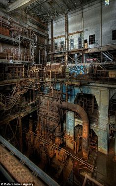 an old factory with lots of pipes and machinery