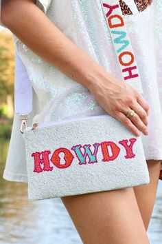 Introducing the "Howdy Friends" crossbody bag - a stunning mix of bright colors and classic style! The white beaded backdrop for the cheerful "Howdy" phrase will add a pop of color to any outfit. Carry your essentials around in style and make a statement! Comes with a gold chain. Brand: The Royal Standard Cotton and Resin Beads Spot Clean Only Trendy Beaded Shoulder Bag For Spring, Trendy Spring Beaded Shoulder Bag, Trendy Beaded Crossbody Shoulder Bag, Beaded Crossbody Bag, Resin Beads, Bright Colors, Gold Chain, Gold Chains, The White