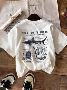 FREE shipping on all additional items 90's Great white Shark T-shirt, Unisex Shark Lovers Hoodie "---How To Order --- 1-) Please, check and review all photos 2-) Choose your t-shirt size and color *Different styles of shirts may have different shades of same color choice due to different manufacturer brands. *For this reason, we recommend you to match shirts from the same styles if you want precisely matching colors (exa. Unisex,Sweater, Hoodies, etc.). *If you want perfect matching you can choose ""BLACK"" or ""WHITE"" shirts."" 3-) Click add to cart. You can go back to add more product 4-)Click ""Proceed to check out"" 5-)When you check out, you can add a note to seller for any request Unisex * Unisex t shirt fits like a well-loved favorite, featuring a crew neck, short sleeves and desig Shark Shirt Aesthetic, Cute Graphic Shirts, Shark Things, Shark Clothes, Shark Shirts, Summer Slogans, Grafic Tees, Shark Hoodie, Shark Shirt