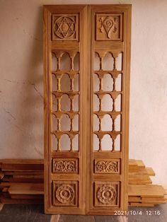 two wooden doors sitting next to each other