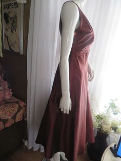 "1990's sleeveless, deep-V front/back bronze/dark brown cocktail dress, by Nicole Miller of New York, in a size 6. Dress has a big flared circle skirt, with attached under slip of silk/netting, back nylon zipper, outer dress fabric is silk. Front bodice is in a deep-V cleavage in a large bust bow look, as well as a deep-V bodice back. Dress is in great condition, Bust 32 1/2\", Waist 28\". PRICE IS $179.00------SALE FINAL/AS IS/NO RETURNS." Brown Cocktail Dress, Brown Cocktail, Outer Dress, Brown Flares, Flowing Dresses, Back Dress, Size 6 Dress, Nicole Miller, Circle Skirt