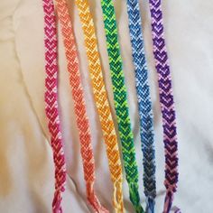 four different colored ropes are lined up together