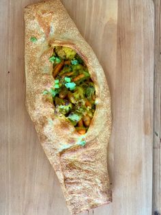 a piece of bread with vegetables on it