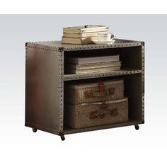 an open bookcase with two baskets on top and books in the bottom drawer, sitting next to each other