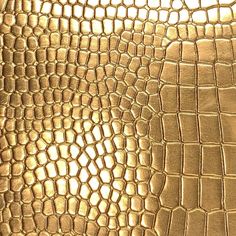 an image of gold leather textured with alligator skin pattern on the outside and inside