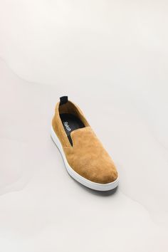 Handcrafted just outside of Florence with the finest Tuscan calf leather and suede. The Slip On Sneaker is unlined, has a removable Ortholite insole with open cell technology for cushioning and breathability, all constructed on rubber cup soles featuring our Inner Bounce foam for energy return and shock absorption. Leather Slip-on Walking Shoes With Rubber Sole, Sporty Leather Slip-on Walking Shoes, Comfortable Suede Sneakers With Leather Sole, Leather Low-top Slip-ons For Walking, Suede Slip-ons With Leather Sole And Round Toe, Sporty Loafers With Round Toe And Rubber Sole, Suede Walking Shoes With Textured Sole, Comfortable Suede Leather Shoes With Leather Sole, Leather Loafers With Branded Insole For Walking