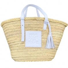 The St. Barth's Tote . Woven from dried palm leaves with a thick white embossed leather logo patch and short white handles and a leather accent tassel. Bag measures : 16"L X 10.5" H X 10" W Handmade in Morocco by artisans with natural materials to support sustainability. White Straw Bag With Woven Leather, Luxury White Straw Bag For Beach, White Woven Leather Straw Bag For Beach, White Leather Straw Bag For Travel, White Leather Straw Bag With Braided Handles, Dried Palm Leaves, White Handles, Winter Getaway, Tassel Bag