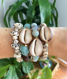 Loving these bracelets by @madewithalohabytay on #IG. #TheBeadChest #EthicallySourced #Jewelry #Chic #AfricanBeads #StoneBeads #DecorativeBeads #Turquoise #DIY #Boho #JewelryBlogger #BeadMaker #HealingStones #CrystalJewelry #HomeDecor #InteriorDesign #DIYDecor #UpcycledJewelry #RomanGlass #Handmade #HandmadeJewelry #Turquoise #PrayerBeads #WomensFashion #Beauty #MensFashion #Weaving #DIYCrafts #Necklace #BeckyOwens #Agate #FusedGlass #BeckyOwensStyle Bohemian Beaded Bracelets With Oval Beads For Beach, Artisan Wooden Beads For Beach, Handmade Bohemian Shell Beaded Bracelets, Handmade Bohemian Beaded Shell Bracelets, Artisan Beaded Bracelets With Gemstone Beads For Beach, Beach Jewelry With Oval Wooden Beads, Bohemian Shell Beaded Bracelets, Bohemian Natural Hand-strung Beads, Bohemian Oval Beads Bracelets For Beach