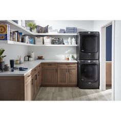 a black washer and dryer in a kitchen