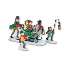 a group of figurines that are sitting on top of a sleigh