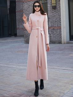 "This woman long wool coat in pink is a timeless winter piece that will add a divine pop of color to your winter wardrobe. This coat is a stunning color, lovely length, and keeps me warm. Endlessly versatile, layer it over jeans and sweaters or sleek dresses for countless styling options. FEATURES 50% wool blend, 50% polyester Polyester lining Single breasted coat A Line Belted coat Long sleeve High collar Two side pockets Perfect for winter, autumn Dry clean More colors select from (Photo L1) h Long Wool Coat For Spring, Spring Wool Coat In Solid Color, Spring Long Wool Coat Solid Color, Spring Long Wool Coat In Solid Color, Elegant Pink Single Breasted Wool Coat, Pink Single Breasted Wool Coat For Fall, Pink Long Wool Coat For Winter, Pink Long Wool Coat For Fall, Pink Single-breasted Wool Coat For Fall