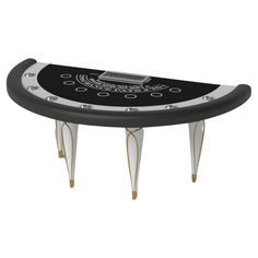 a black and white poker table with gold accents on the legs, in front of a white background