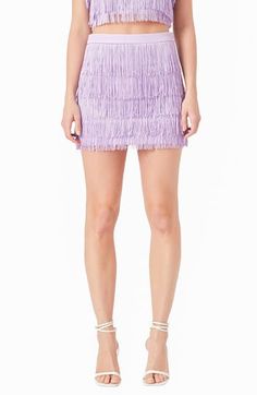 Fabulous fringe that sways with every step is tiered to perfection on this chic, dance floor–ready miniskirt. Hidden side-zip closure Lined 100% polyester Hand wash, dry flat Imported Glamorous Spring Pleated Skirt, Chic Summer Mini Skirt With Tassels, Summer Chic Mini Skirt With Tassels, Flirty Mini Hem Skirt For Party, Flirty Mini Hem Party Skirt, Glamorous Spring Ruffled Skirt, Spring Party Skirt With Mini Hem, Fitted Fringe Mini Skirt For Spring, Summer Mini Skirt With Tassels