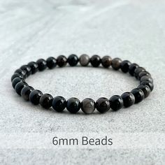 Men's beaded bracelet features: ~ 6mm, 8mm or 10mm Grey Obsidian beads ~ Stretchy cord; simply slide bracelet on and off wrist ~ Comes packaged in a re-usable microfiber pouch To ensure the perfect fit, please use the bracelet sizing instructions found in the photo gallery. Earthy Design, Slide Bracelet, Mens Beaded Bracelets, Beaded Stretch Bracelet, Inner Strength, Stretch Bracelet, Bracelet Sizes, Wood Beads, Stretch Bracelets