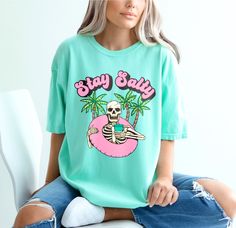 Stay salty skeleton beach shirt. UNISEX SHIRT 100% USA cotton Pre-shrunk so no need to worry about shrinkage Comfort Colors Brand Heavyweight material for a more comfortable fit Relaxed fit. Order a size up for a more baggy feel. Skull Print Cotton Beach Tops, Cotton Beach Tops With Skull Print, Casual Skull Print Summer T-shirt, Beach Skull Print Short Sleeve Top, Beach Short Sleeve Top With Skull Print, Skull Print Short Sleeve Beach Top, Short Sleeve Skull Print Beach Top, Casual Skull Print Tops For Vacation, Summer Beach Tops With Skull Print