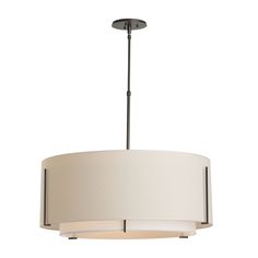 a white drum light hanging from a ceiling fixture