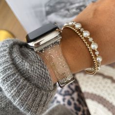 Upgrade your Apple Watch with the Aurora Silicone Band. Firstly, this glitter silicone apple watch band, sparkling with glitter, effortlessly turns your watch into a style statement. More than just a band, it distinctively reflects your unique fashion sense. Secondly, you'll find the Aurora Band, crafted from high-quality transparent silicone, feels soft on your skin and stands up to everyday wear. Its glittery texture adds charm to your wrist seamlessly, making it perfect for both daily wear an Apple Watch Se 2nd Generation, Pandora Bracelet With Apple Watch, Apple Watch Styling, Bracelet Stack With Apple Watch, Apple Watch Charms, Watch Bands For Apple Watch, Apple Watch Bands Fashion, Bracelet Apple Watch, Glitter Dust