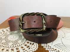 Vintage Vera Pelle genuine leather belt - Brown genuine leather belt Dimensions : Width - 3.7 cm The belt is adjustable from 88 cm to 99 cm Length : 108 cm (excluding buckle) Brand : Vera Pelle Material : Genuine leather with metal buckle In very good condition . One buckle diamond is missing For other GENUINE LEATHER BELT please check here : https://www.etsy.com/shop/TheVINTAGEShopBG?ref=simple-shop-header-name&listing_id=664787628&section_id=22639651 All pictures are real . You buy exa Adjustable Leather Belt Buckle With Antique Design, Adjustable Leather Belt Buckle With Antique Finish, Adjustable Leather Belt With Antique Buckle, Leather Belts And Suspenders With Antique Buckle, Adjustable Leather Belts And Suspenders With Antique Buckle, Genuine Leather Belt, Suspender Belt, Metal Buckles, Leather Belt