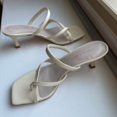 White Charles & Keith Sandals Size 34. Never Worn. I Love These But Unfortunately They're Too Narrow For Me. Please Let Me Know If You Have Any Questions Or Would Like Additional Photos. Cream Toe Post Sandals For Spring, Spring Cream Toe Post Sandals, White Toe Post Sandals For Spring, Summer White Toe Post Heels, White Toe Post Heels For Summer, White Trendy Toe Post Heels, Trendy White Sandals With Heel Loop, White Toe Post Heels With Heel Loop, White Heels With Single Toe Strap For Summer