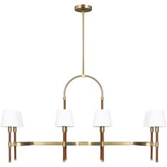 a brass chandelier with three white lamps hanging from the bottom and one light on top